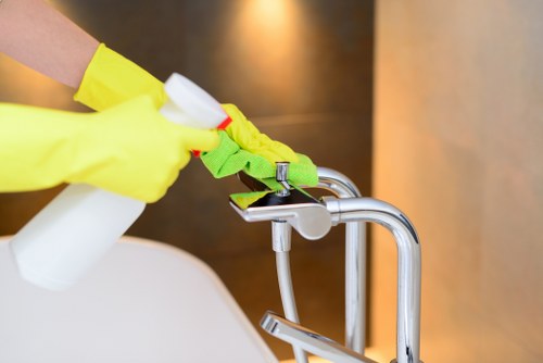 Local cleaners working in a Knightsbridge home with attention to bathrooms and floors