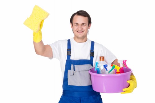 Cleaner starting a safe cleaning task with protective equipment