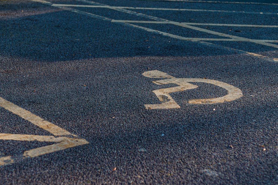 Close-up of a designated parking space number '22' painted in white on dark asphalt pavement, with surrounding parking lines visible. The surface appears textured and well-maintained, suitable for residential or commercial parking areas. The lighting highlights the clean and clear markings, emphasizing proper surface hygiene. This image is relevant to the topic of access and parking for Knightsbridge cleaners, as provided by Cleaner Knightsbridge, illustrating organized parking facilities for service appointments.